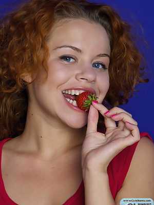 Sweet red haired teeny enjoys ripe strawberries in the most erotic and