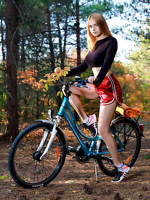 Fit teen Dakota Pink strips naked in the woods during a bike ride