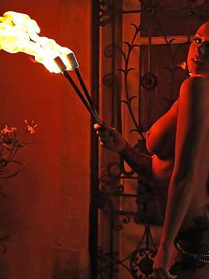 European fire breather Daniella Mae displaying big tits and pierced nipples