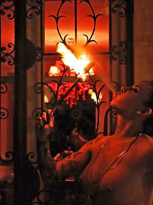 European fire breather Daniella Mae displaying big tits and pierced nipples