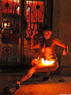 European fire breather Daniella Mae displaying big tits and pierced nipples