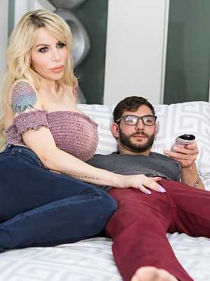 Tattooed MILF pornstar Danielle Derek looses her enormous tits to suck cock