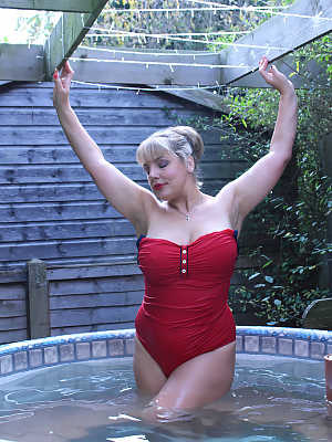 Hot fatty mature Danielle T sheds swimsuit to pour cold water on her big tits