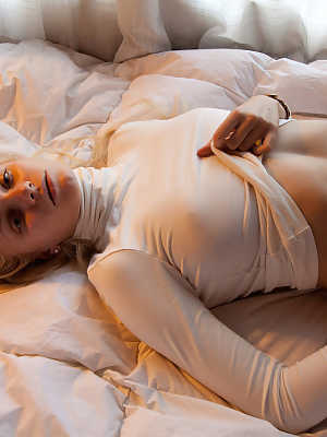 Hot blonde teen Dasha Krasova models nonnude in long sleeves and thong panties