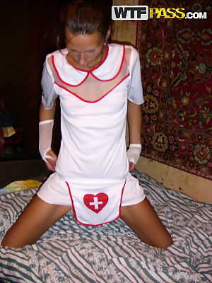 Amateur chick Dasi West poses non nude in a naughty nurse outfit on a bed