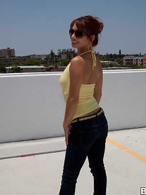 Hot redhead honey Destiny Summers bares medium tits for hot rooftop blowjob