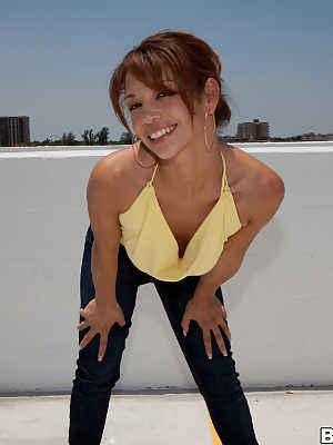 Hot redhead honey Destiny Summers bares medium tits for hot rooftop blowjob