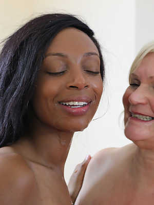 Kinky granny Lacey Starr and two horny pornstars enjoy an interracial blowbang