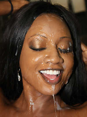 Black female Diamond Jackson has her face drenched in jizz by white men