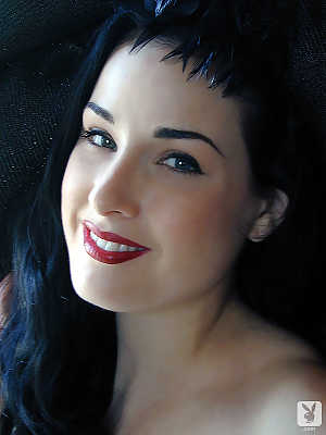 Stunning American brunette with pale skin Dita Von Teese showing off