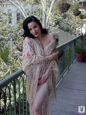 Stunning American brunette with pale skin Dita Von Teese showing off