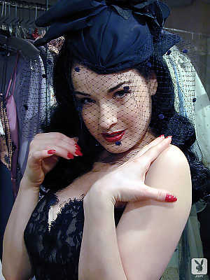 Stunning American brunette with pale skin Dita Von Teese showing off