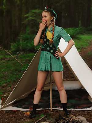 Redheaded Girl Scout Dolly Little gets naked outside her tent in beret