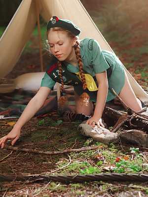 Redheaded Girl Scout Dolly Little gets naked outside her tent in beret