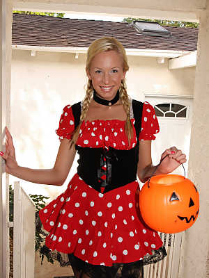 Sexy blonde Eden Adams posing in Halloween costume in solo action