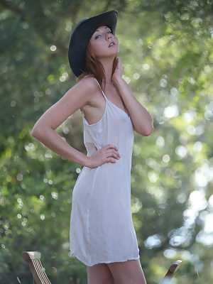 Country girl Elen Moore doffs her cowgirl hat and nightie to pose nude outside