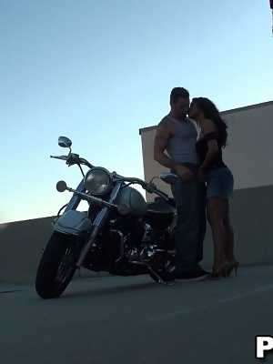 Lovely dark haired chick with big tits sucking and riding dick on the bike