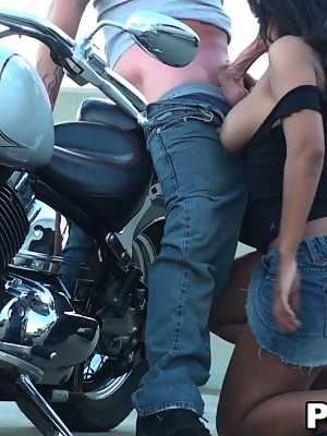 Lovely dark haired chick with big tits sucking and riding dick on the bike