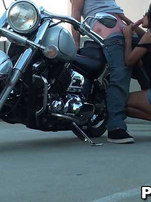 Lovely dark haired chick with big tits sucking and riding dick on the bike