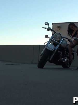 Lovely dark haired chick with big tits sucking and riding dick on the bike