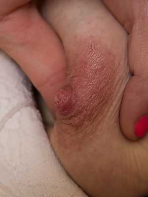 Dark haired amateur Ella Martin stretches her natural pussy wide open