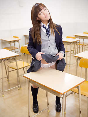 Japanese schoolgirl flashes cotton panties before taking them off in class