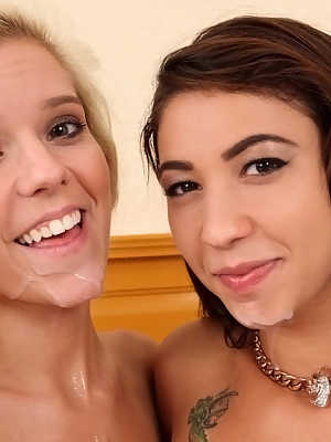 Topless girls Esmi Lee and Halle Von please a cock together with their tongues