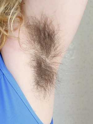 Tattooed amateur Felicia Fisher displays her hairy armpits and beaver