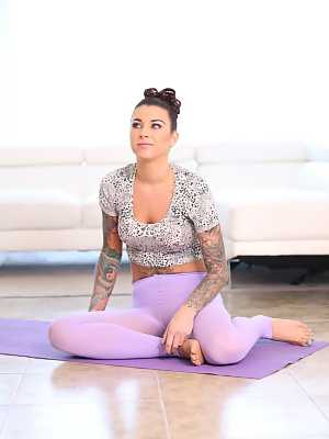 Flexible tattooed Felicity Feline strips on yoga mat to show closeup asshole