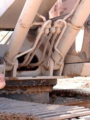 Sultry blonde Fiona Luv poses in the desert in army shirt bikini panty & heels