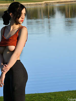 Glamorous Giulia exposes her big breasts while teasing in yoga pants outdoors