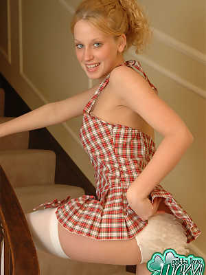 Cute teen girl flashes her ruffled underwear in a dress that is a bit short