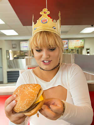 Naughty teen Gwen Stanberg licks her big boobs at the Burger King restaurant