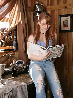 Cute nerdy redhead Gwen Stark reading her books, posing and teasing