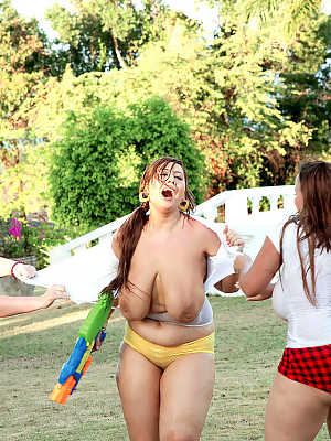 3 obese females rip off each others wet T-shirts while playing outdoor games