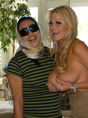 Busty blonde Haley cummings and her man Ryan Madison are posing.