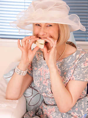 Old granny Hazel loses her dress and plays with a cucumber wearing lingerie