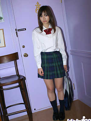Naughty asian schoolgirl Hikaru Koto slipping off her uniform