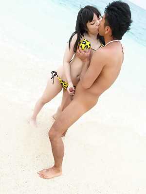 Hina Maeda Asian has clit rubbed and gives fine blowjob on beach