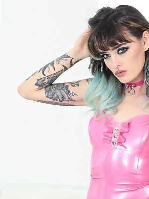 Beautiful fetish doll Holly Beth sheds pink latex dress to pose erotically