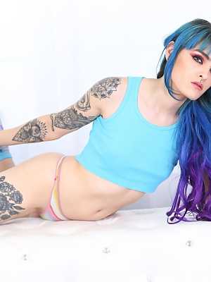 Emo girl Holly Beth with colorful hair and tattooed body gets naked solo