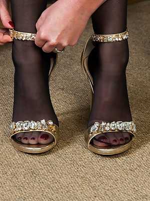 Older amateur Holly Kiss adjust ankles strap heels before showing her goods