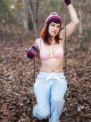 Leggy solo girl Ingrid Mouth posing naked in forest in toque and boots