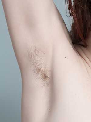 Pale redhead Ariadna Moon shows hairy armpits & toys her furry hole on the bed