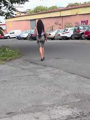 Distressed girl Isabel Dark takes a badly needed pee on a paved roadway