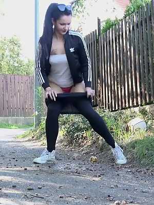 Isabel Dark pulls down her leggings to pee