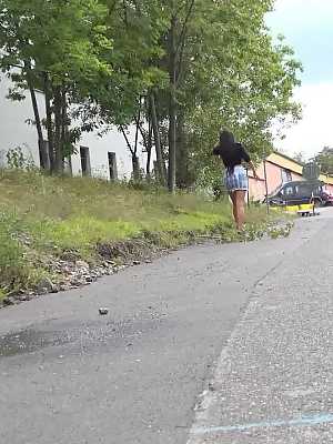 Solo girl Isabel Dark lets loose with a stream of piss on a rural road