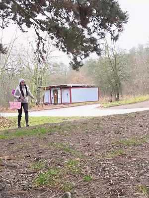 Isabel Dark relieves herself underneath a shelter