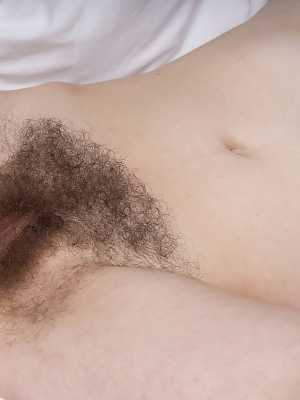 First timer Ivy Addams shows her hairy underarms and beaver atop her bed