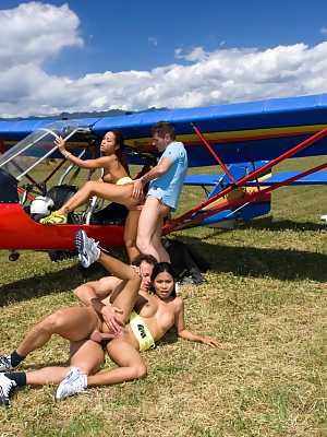 Brunette Asian girls Jade Sin and Priva get nailed by two horny pilots